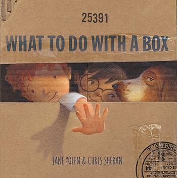 Book cover of 'What to Do with a Box' by Jane Yolen and Chris Sheban, featuring a cardboard box with cut-out faces and a hand.