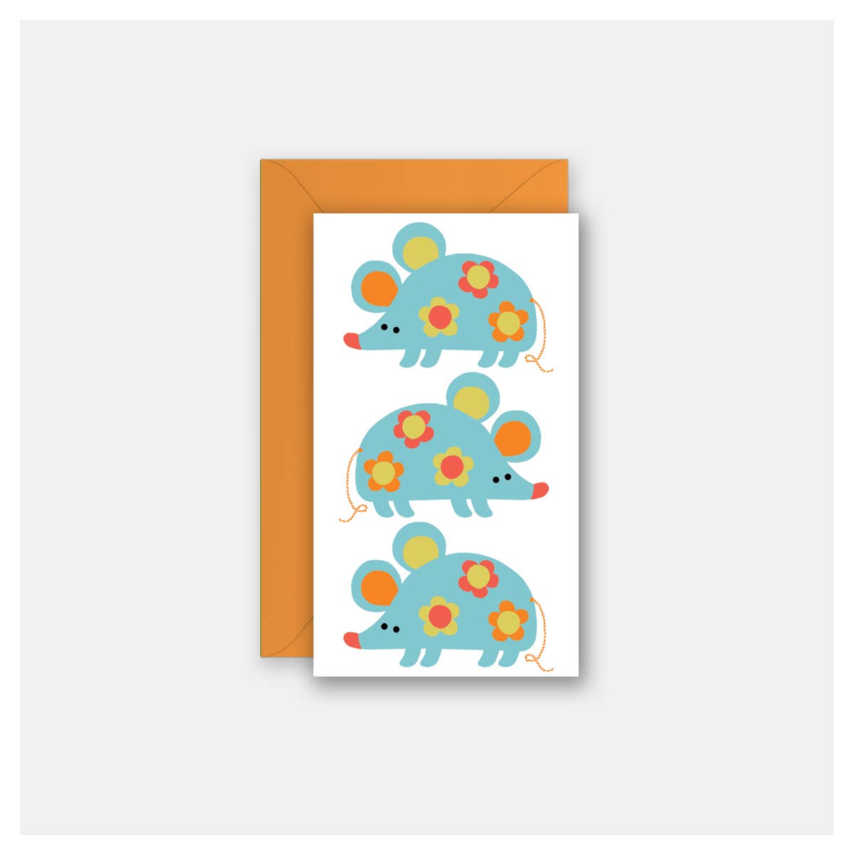 A white greeting card featuring three colorful cartoon mice in light blue with yellow, orange, and red floral patterns, shown with an orange envelope on a light gray background.
