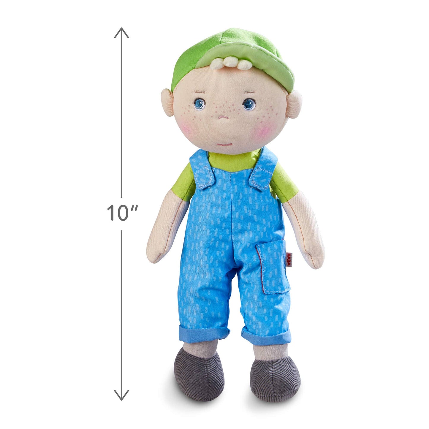 Stuffed toy with a green hat and blue overalls, standing next to a 10-inch height measurement label.
