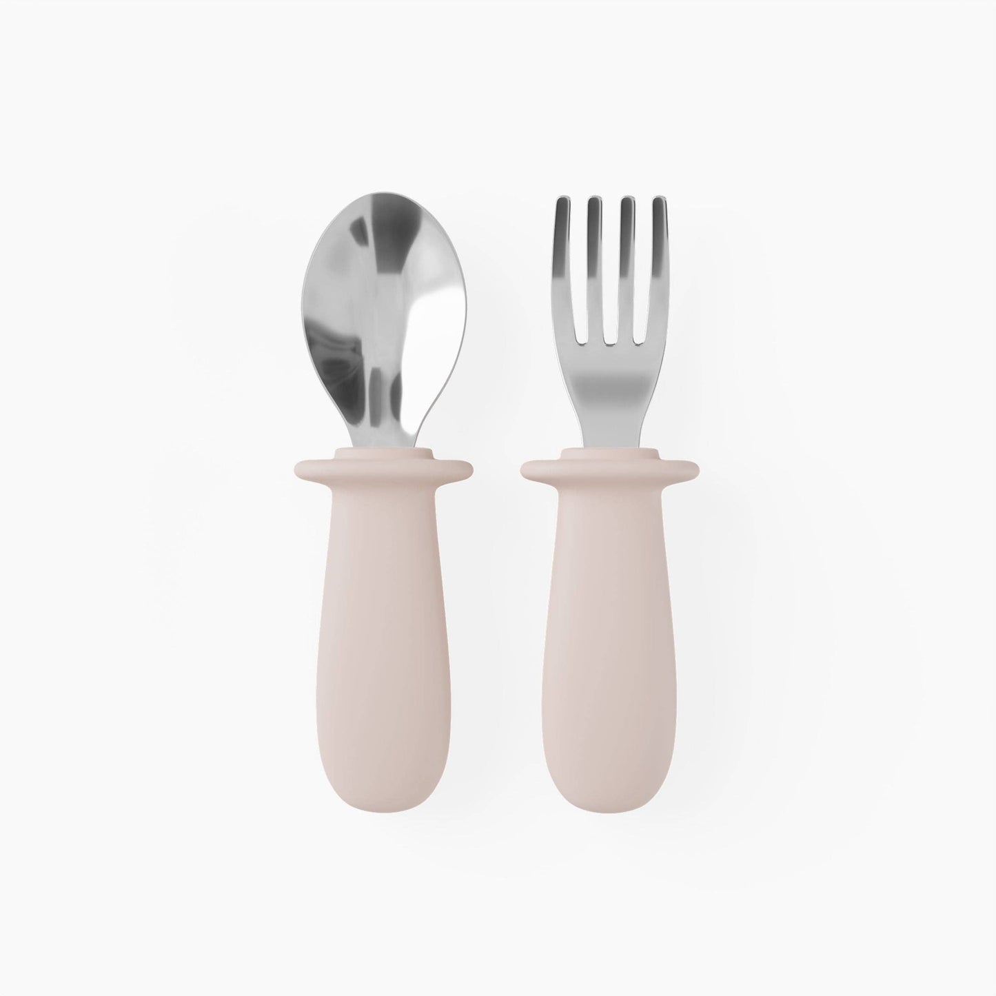 Set of silver spoon and fork with pink silicone handles on a white background