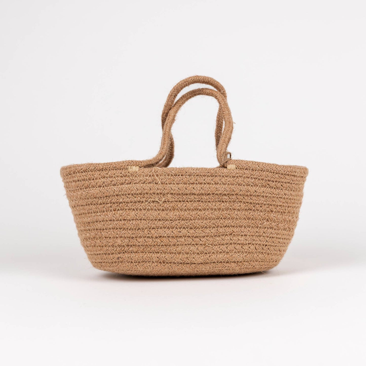 Beige woven bag on a white background
