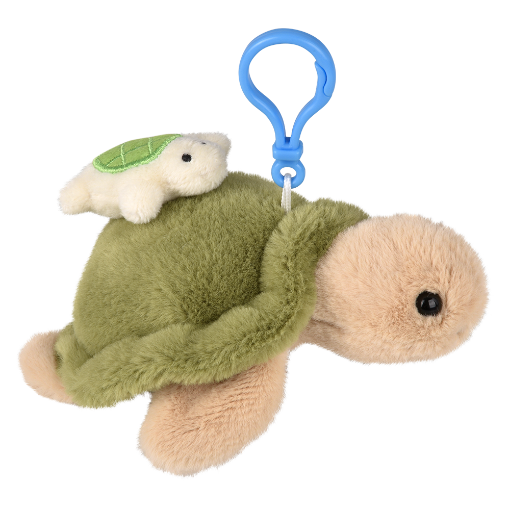 Plush turtle toy with a smaller turtle on top and a blue clip on a white background