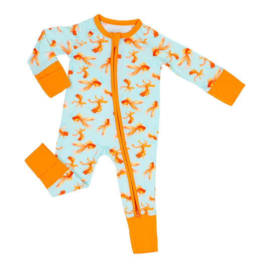 Children's onesie pajama with orange fish pattern on a light blue background