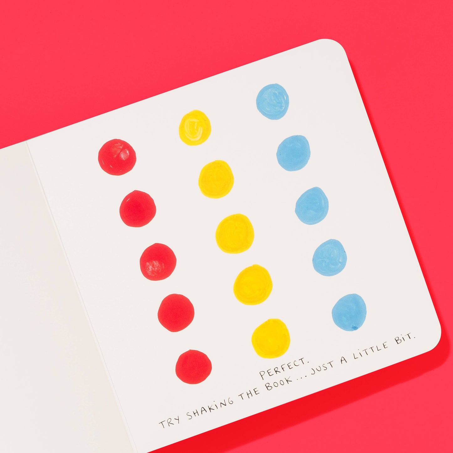Card with colorful dots on a red background
