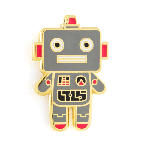 A retro-style robot enamel pin with a gray body, gold metal outline, and red and black accents, shown on a plain white background.