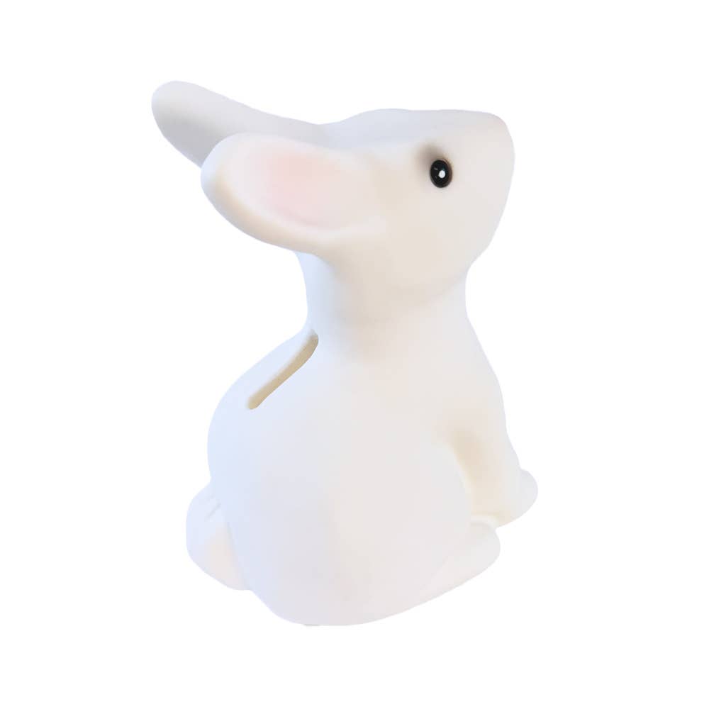 White rabbit shaped coin bank on a white background