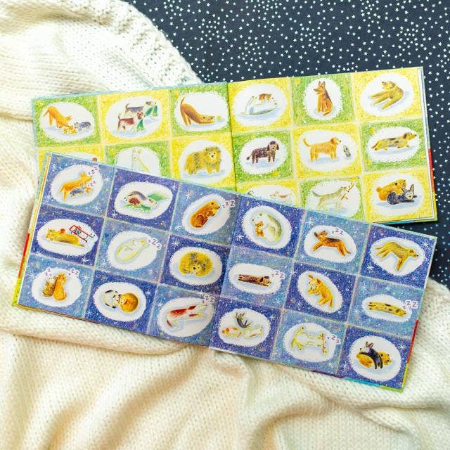 Two sheets of stickers with lion illustrations on a textured surface.