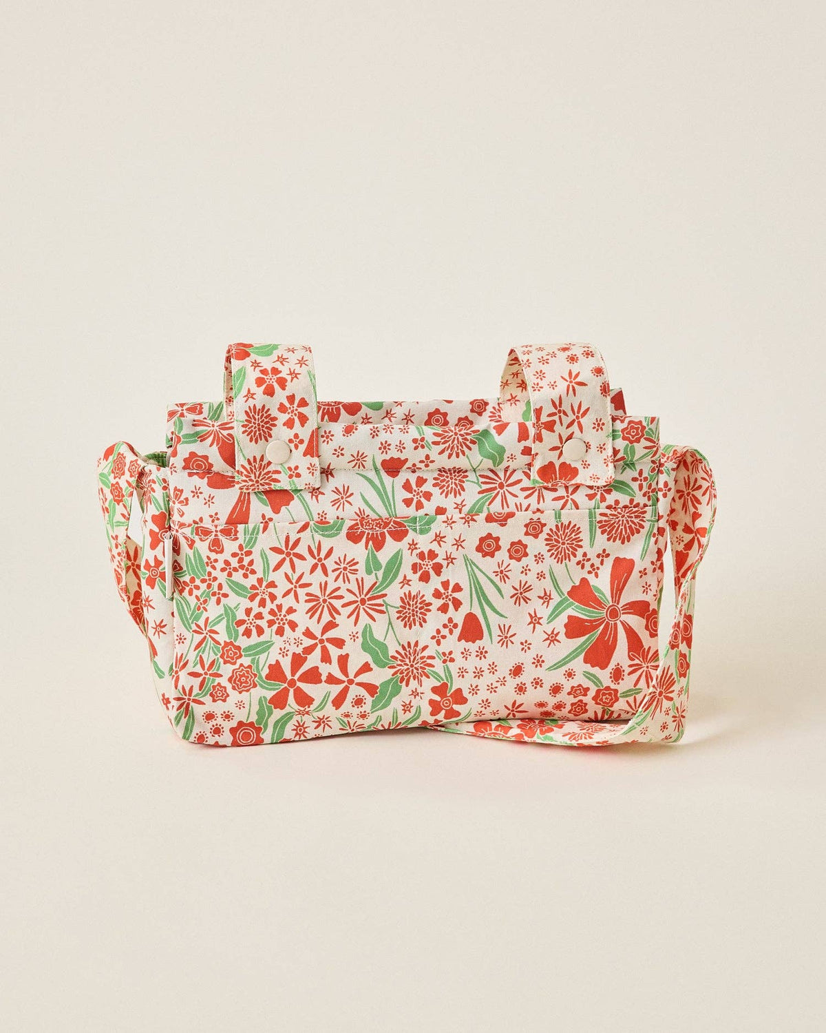 Floral patterned bag on a beige background