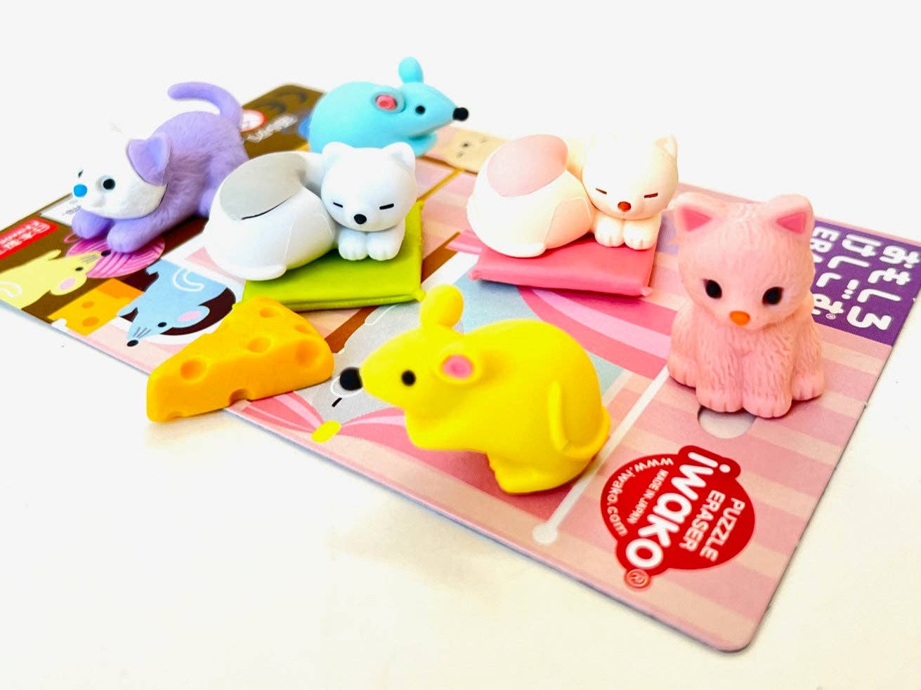 Colorful animal-shaped erasers on a colorful card with 'INWako' branding.