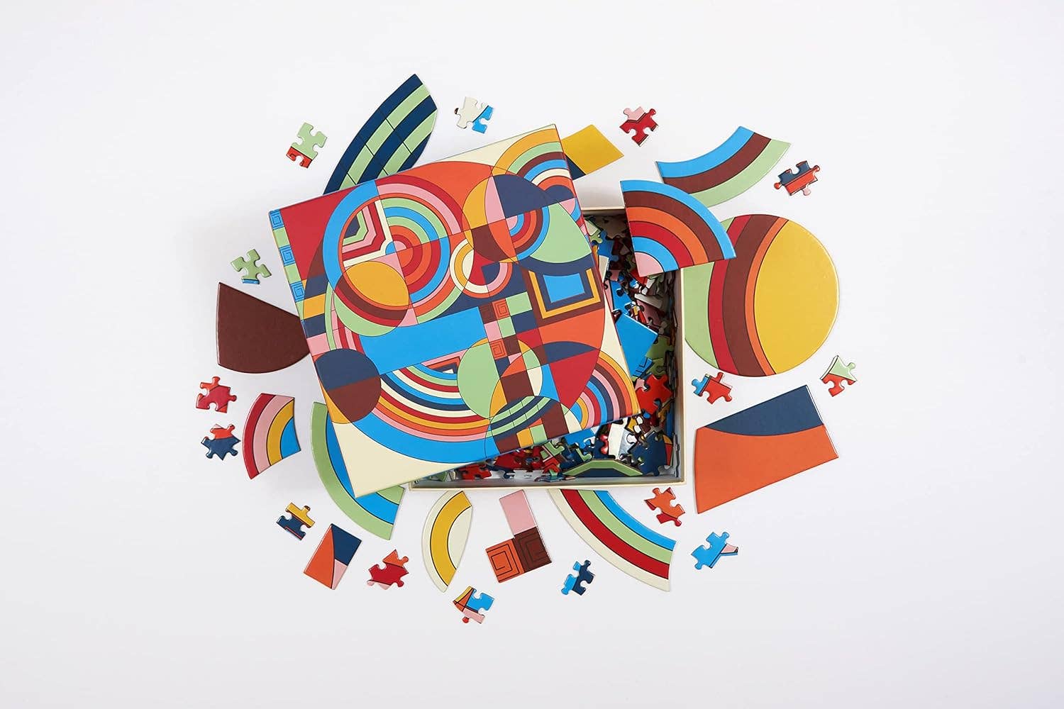 Colorful geometric puzzle with scattered pieces on a white background