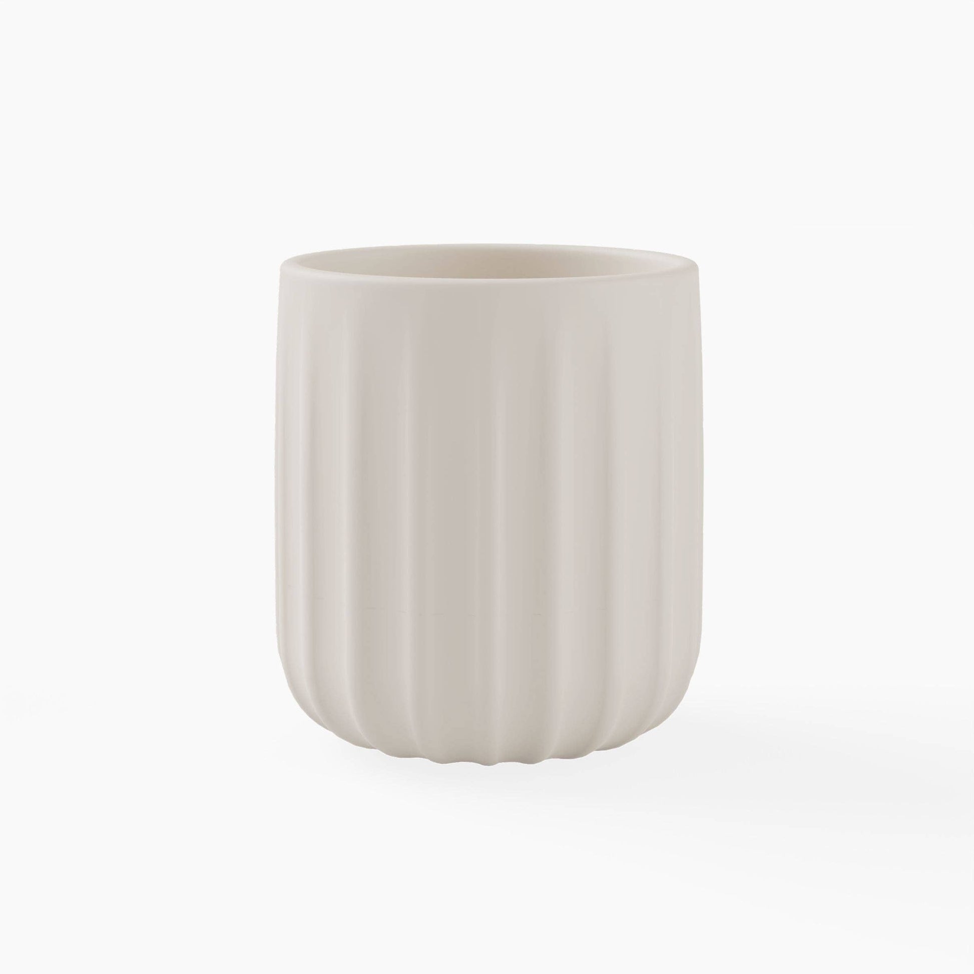 Beige silicone cup on a white background