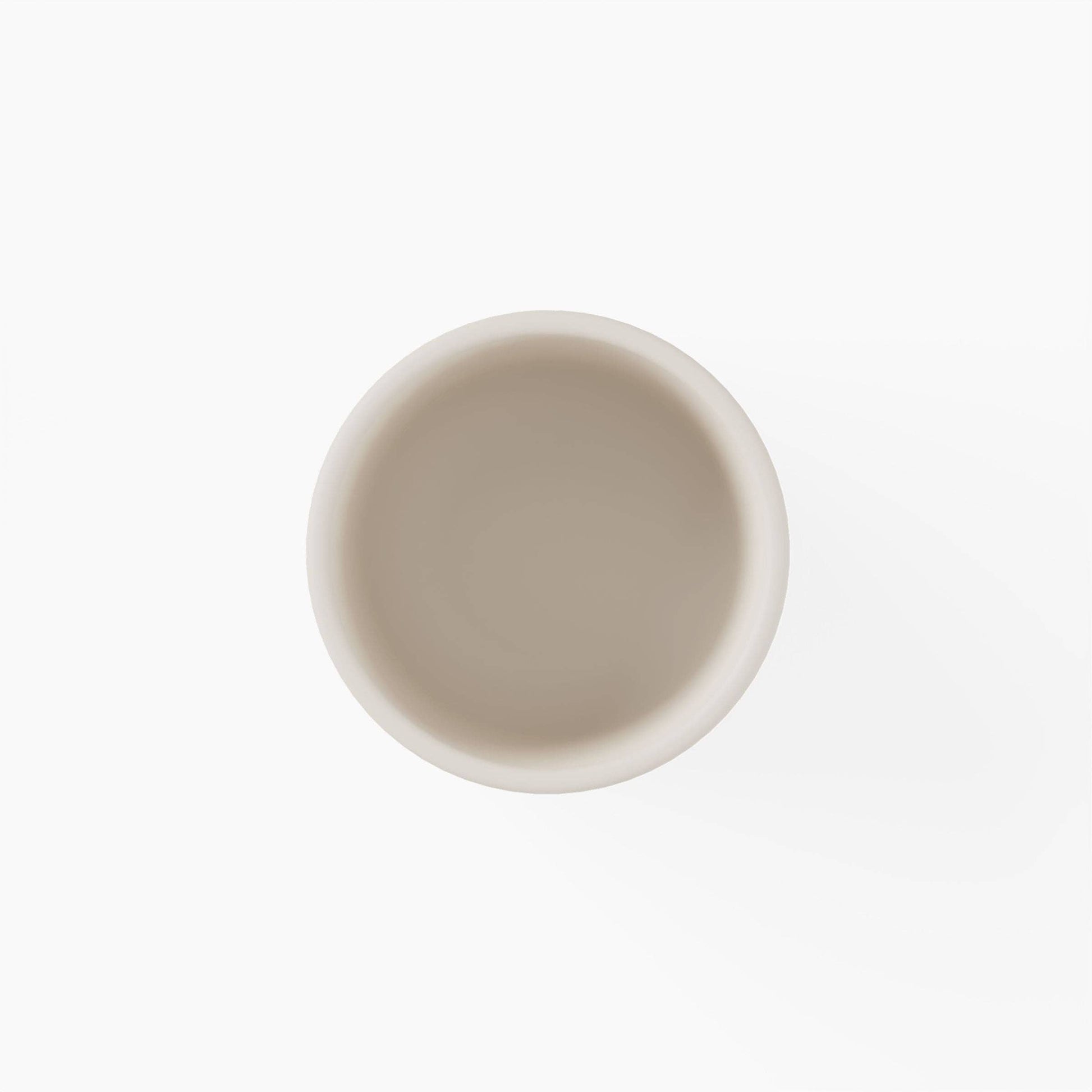Top view of a beige silicone cup on a white background
