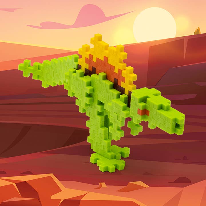 Pixelated green dinosaur puzzle on a desert landscape with a sunset.