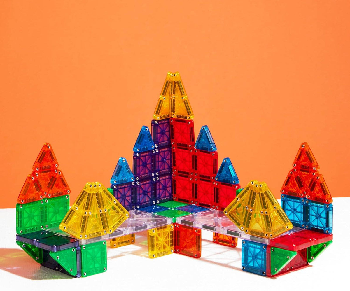 Colorful magnetic building blocks on an orange background