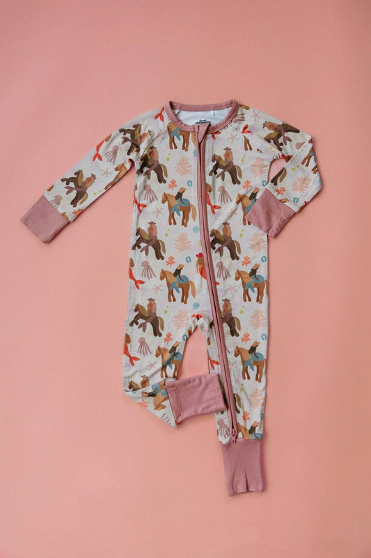 Children's onesie with mermaid cowboy pattern on a pink background