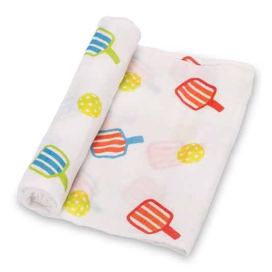 A white rolled baby blanket with colorful pickleball  pattern on a white background