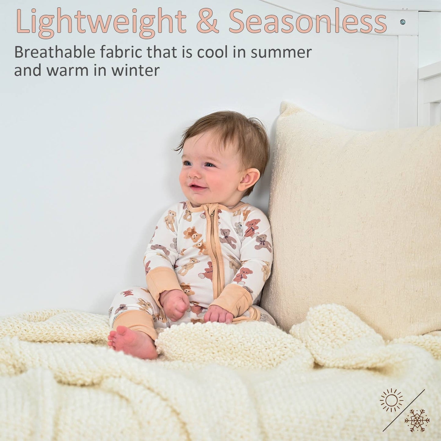 Baby sitting on a bed wearing teddy bear pajamas with text about breathable fabric