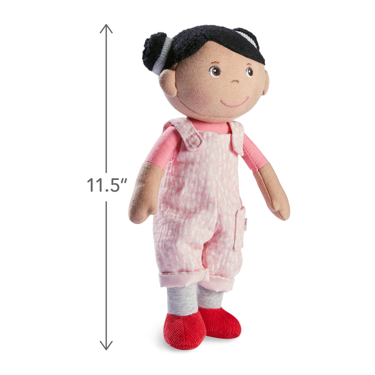 Plush doll with pink overalls and red shoes, standing next to a measurement label indicating 11.5 inches tall.