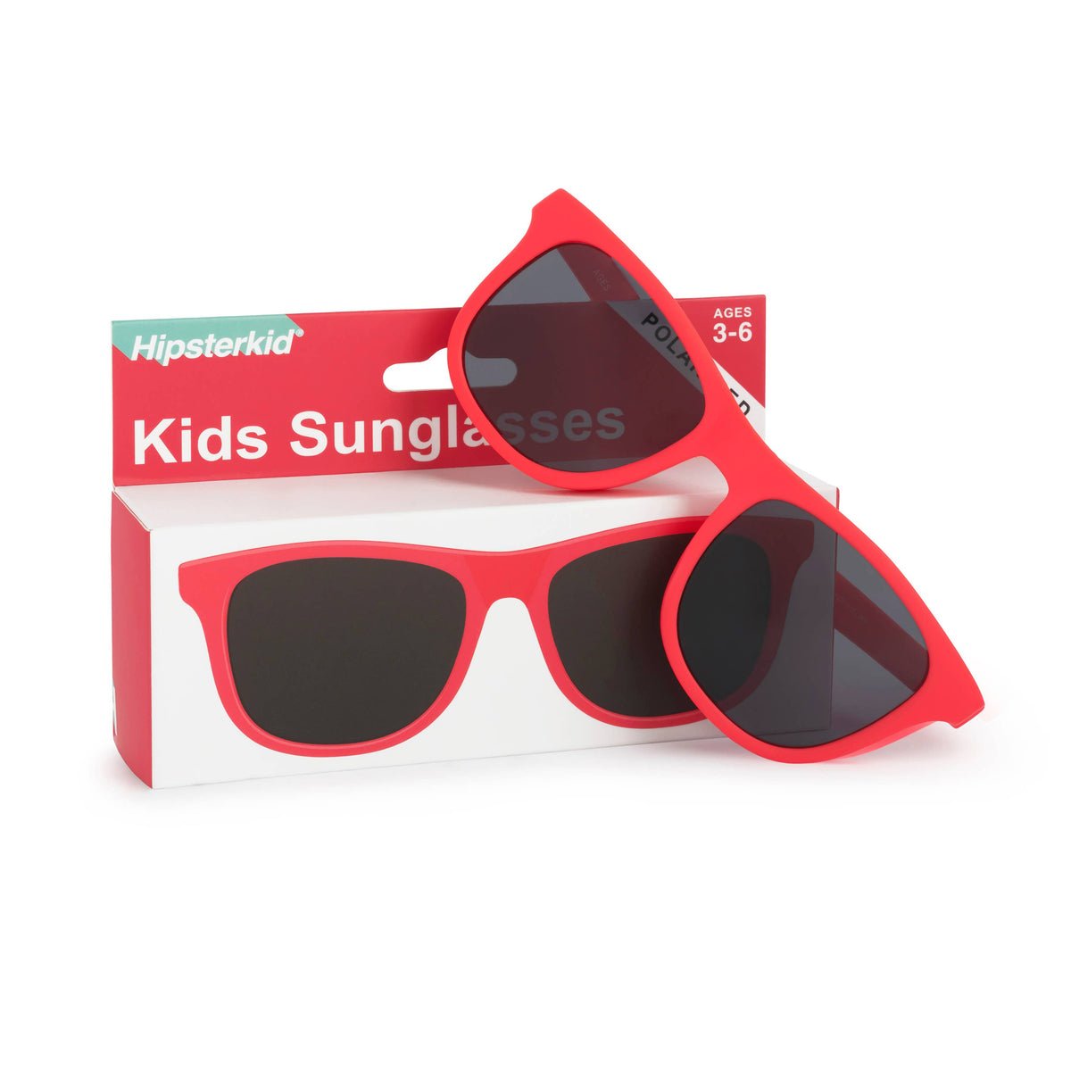 Red kids sunglasses with dark lenses displayed in front of their red and white Hipsterkid retail box on a white background.