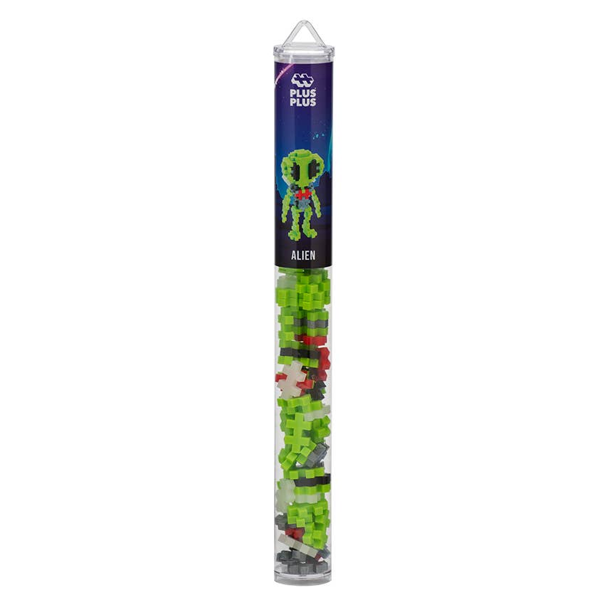 Tube of Plus-Plus alien puzzle pieces on a white background