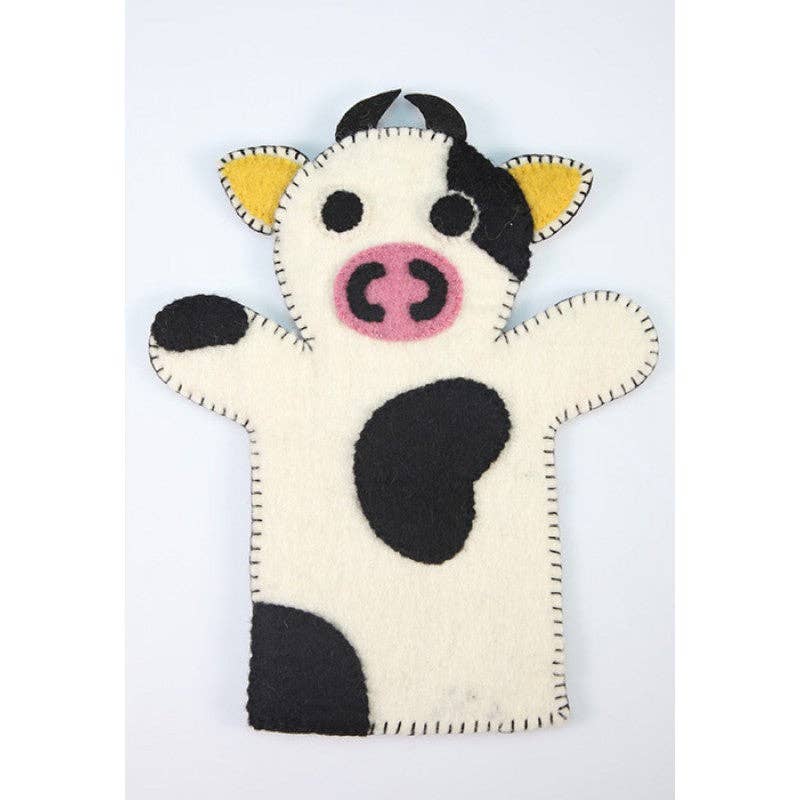 Cow-shaped hand puppet on a white background