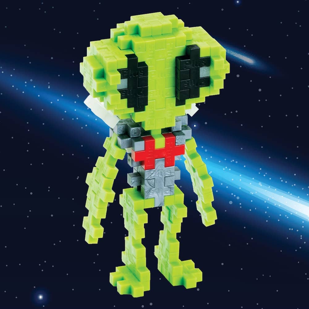 Puzzle figure of an alien with a green head and red chest emblem on a space-themed background
