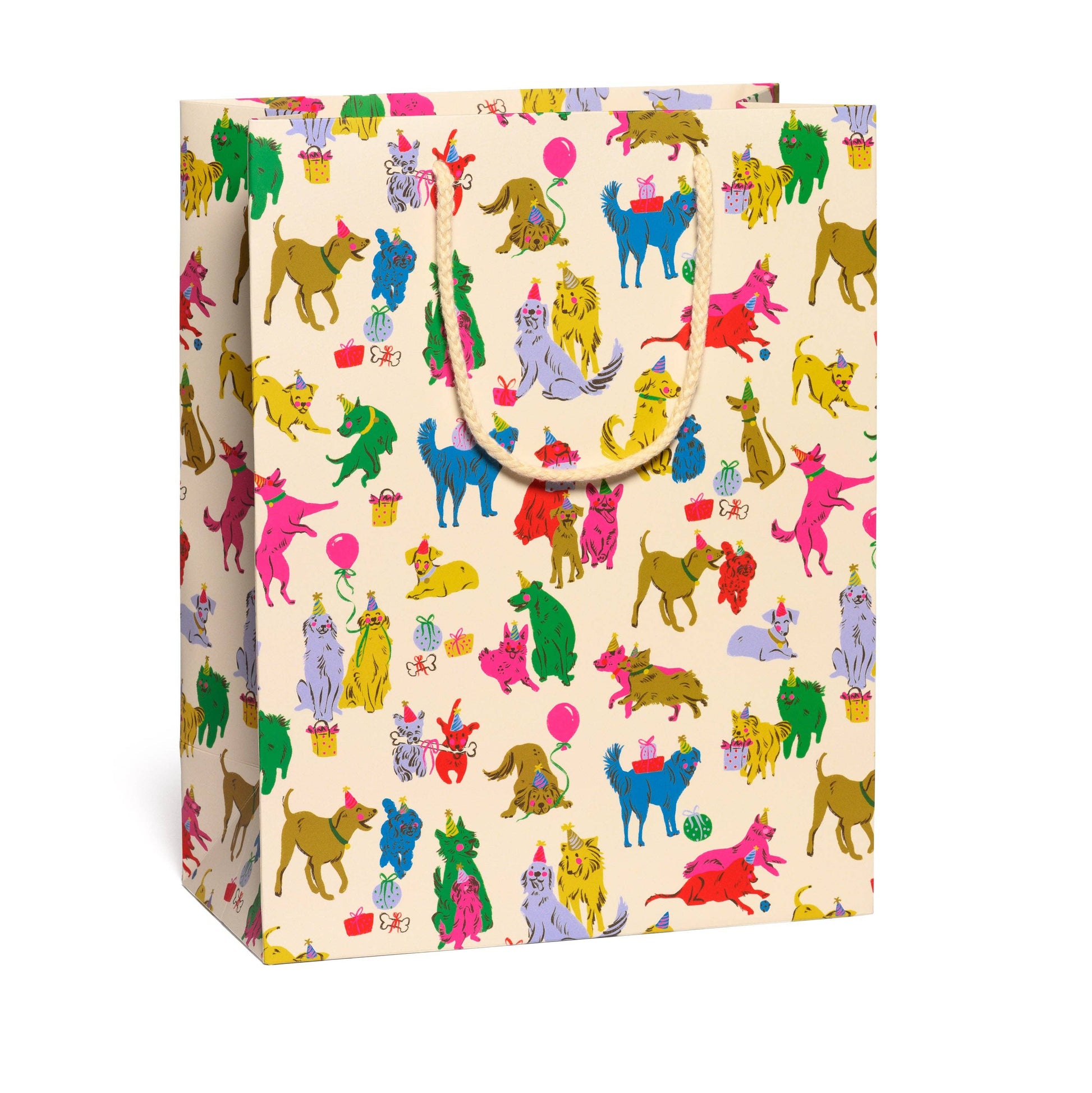 A cream-colored gift bag with a colorful repeating pattern of cartoon dogs in various poses and colors, featuring a rope handle.