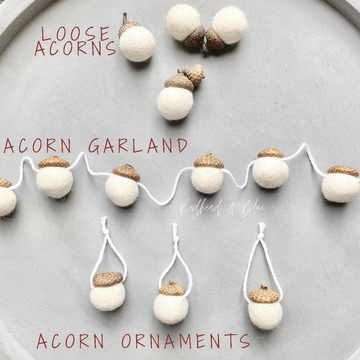Acorn garland and acorn ornaments made from white pom-poms with brown textured acorn caps, arranged on a gray surface with overlaid text reading 'LOOSE ACORNS', 'ACORN GARLAND', and 'ACORN ORNAMENTS'.