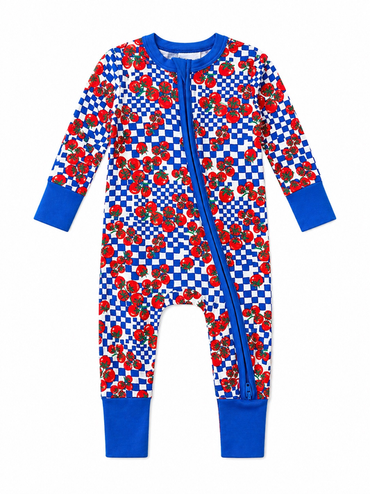 Children's pajama with red and blue checkered tomato pattern on a white background