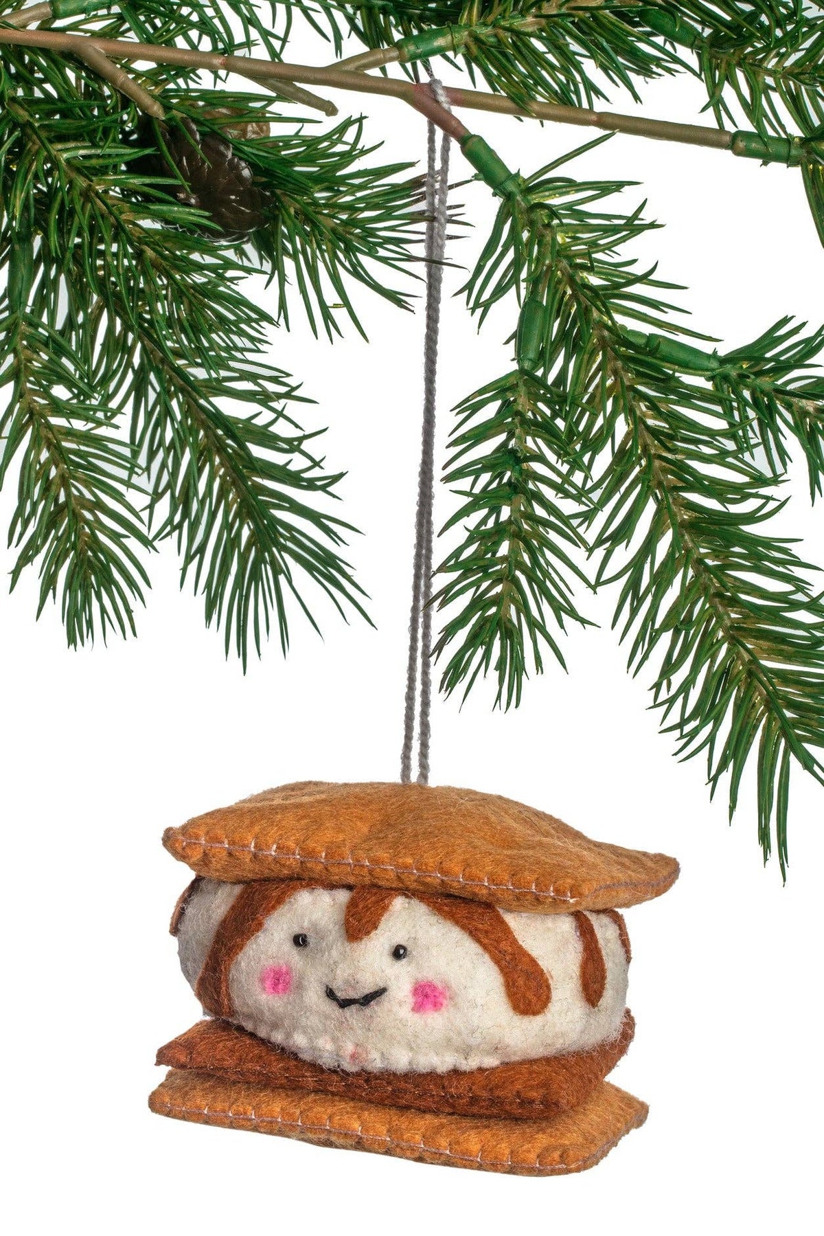 Felted marshmallow character ornament hanging on a Christmas tree branch.