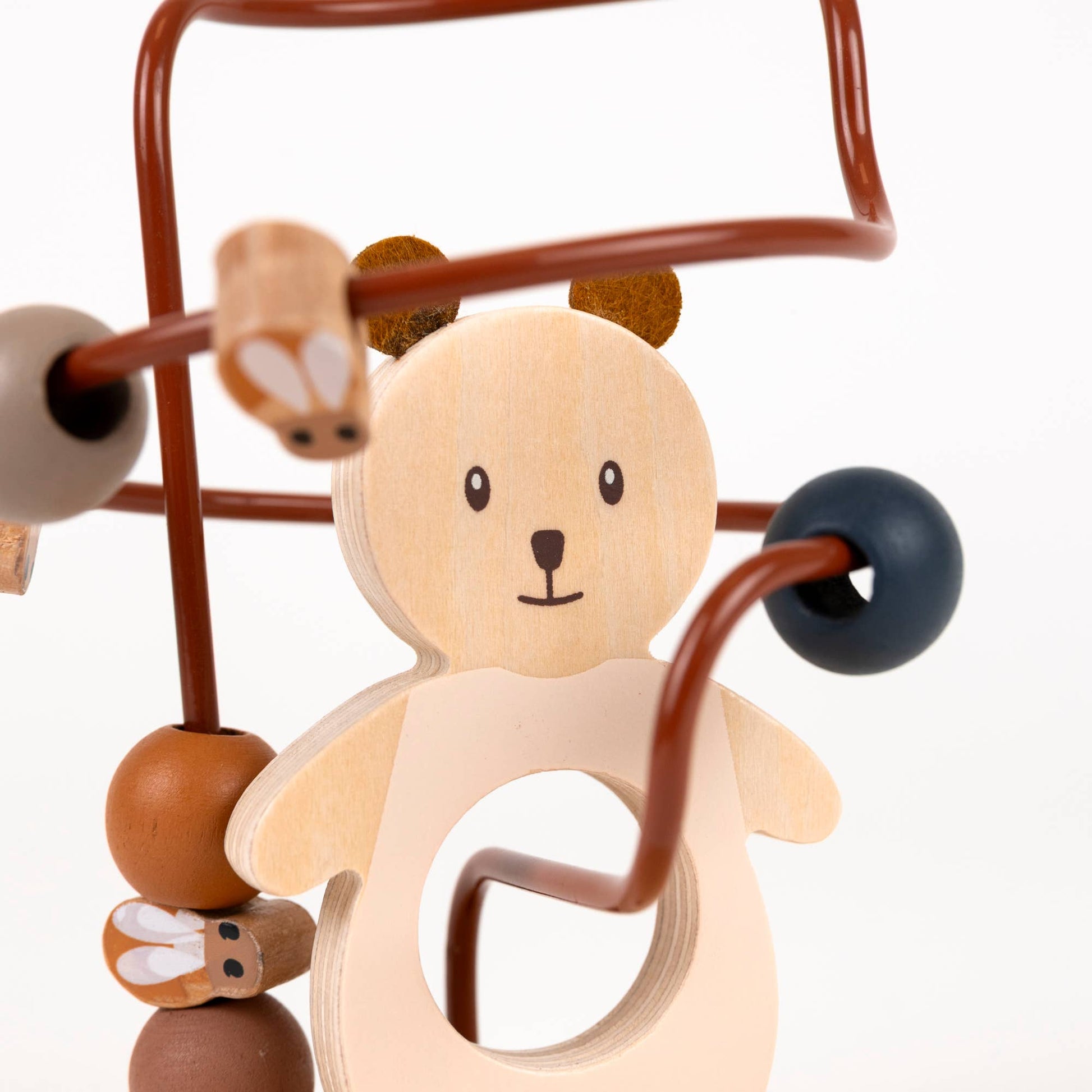 Wooden baby toy with a bear face and colorful beads on a white background