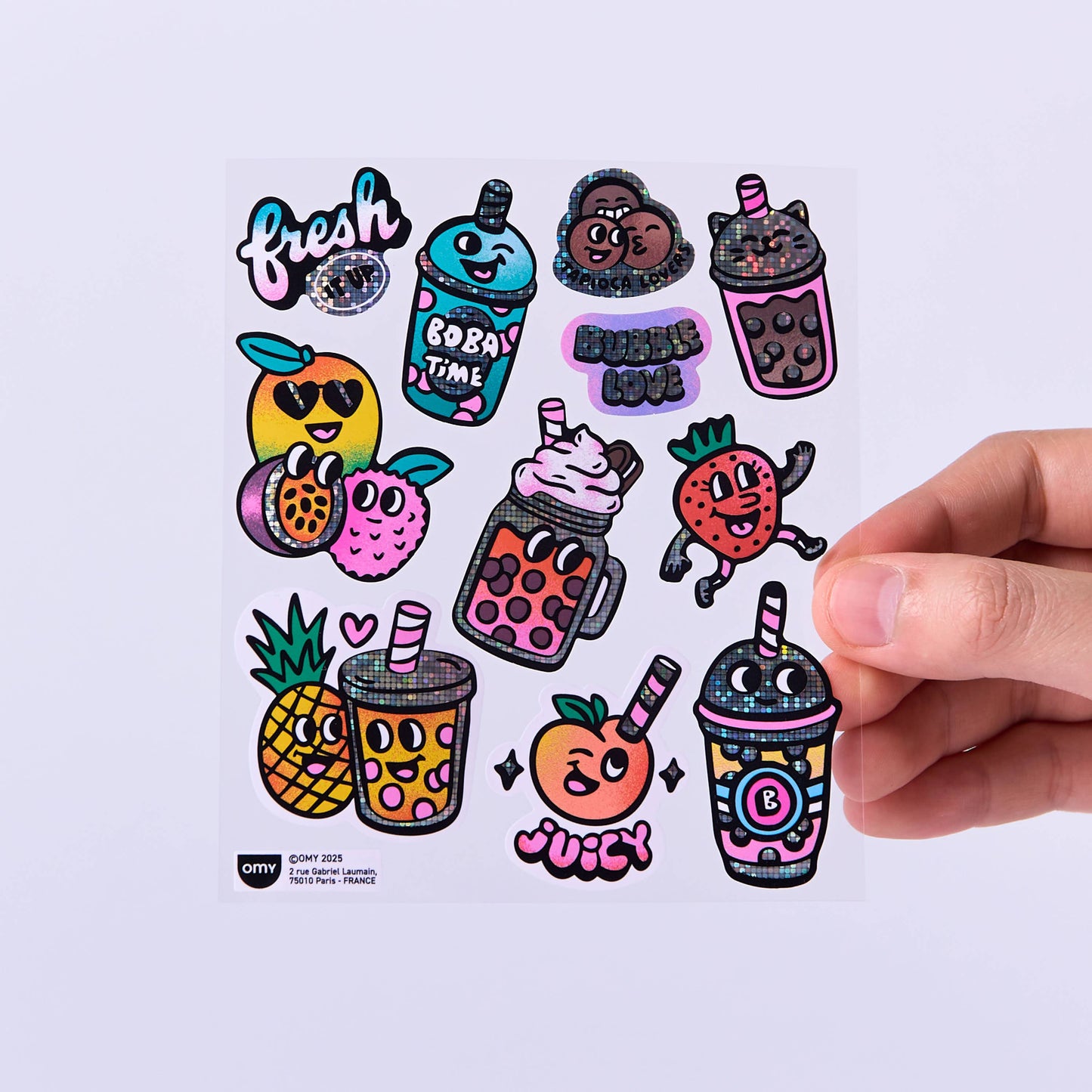 Sheet of colorful bubble tea-themed stickers with a hand holding one sticker.