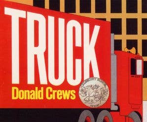 Book cover of 'Truck' by Donald Crews with a red truck and gold medal illustration.