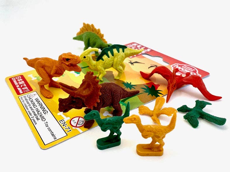 Assorted colorful dinosaur figurines on a white background