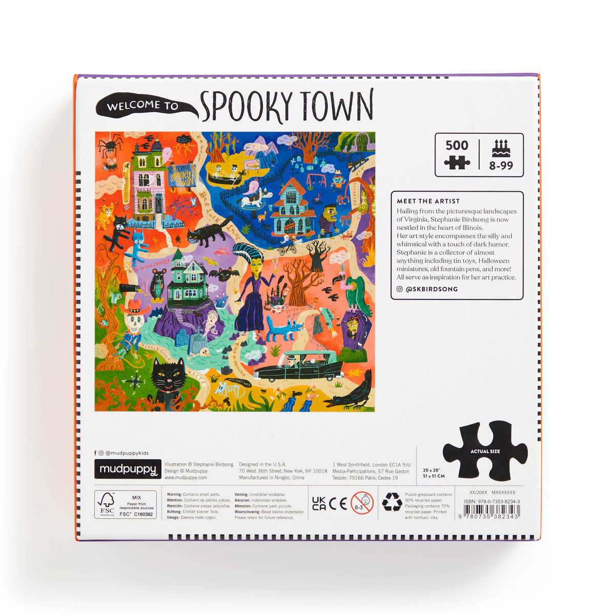 Jigsaw puzzle box for 'Spooky Town' with colorful illustration on a white background