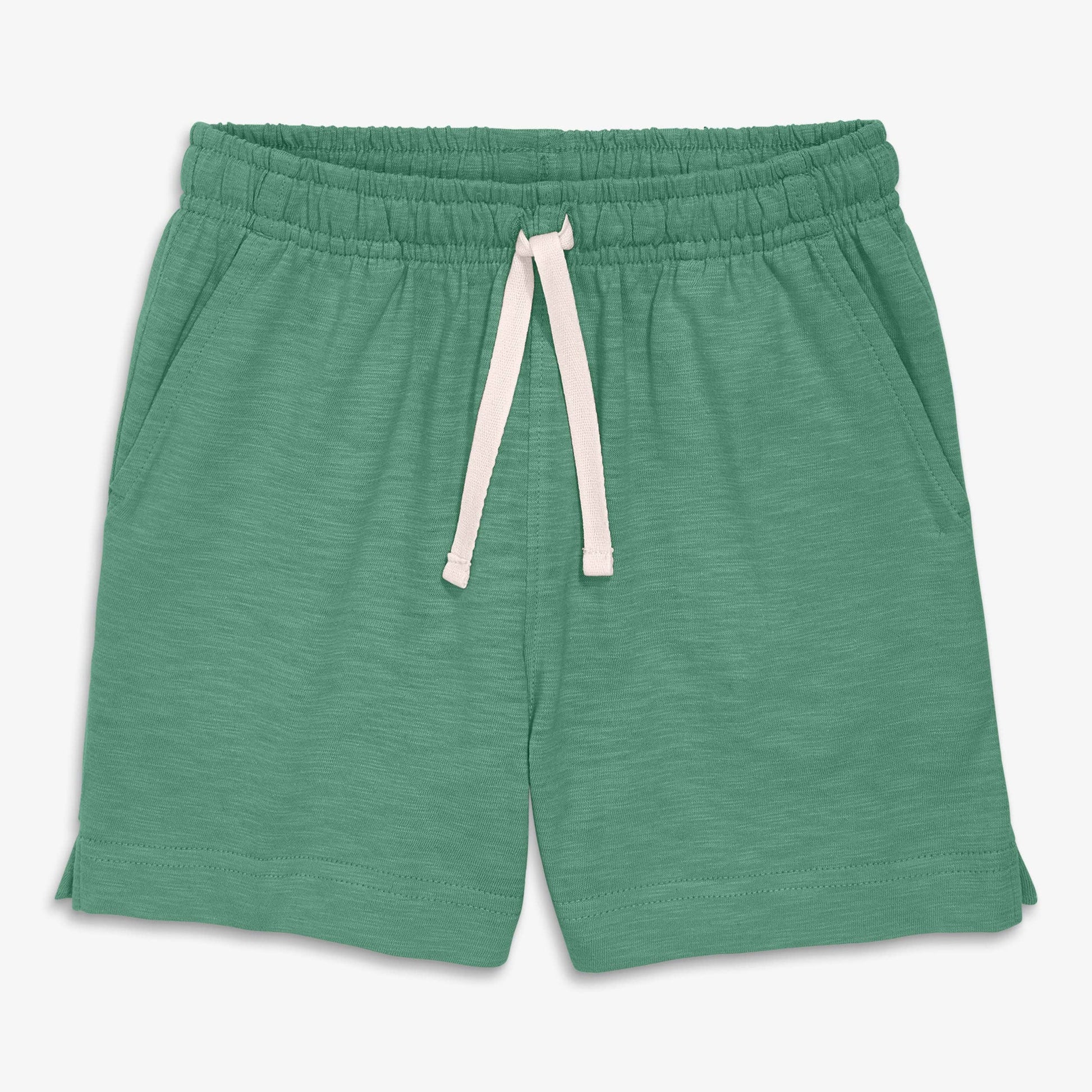 Green shorts with a drawstring on a white background