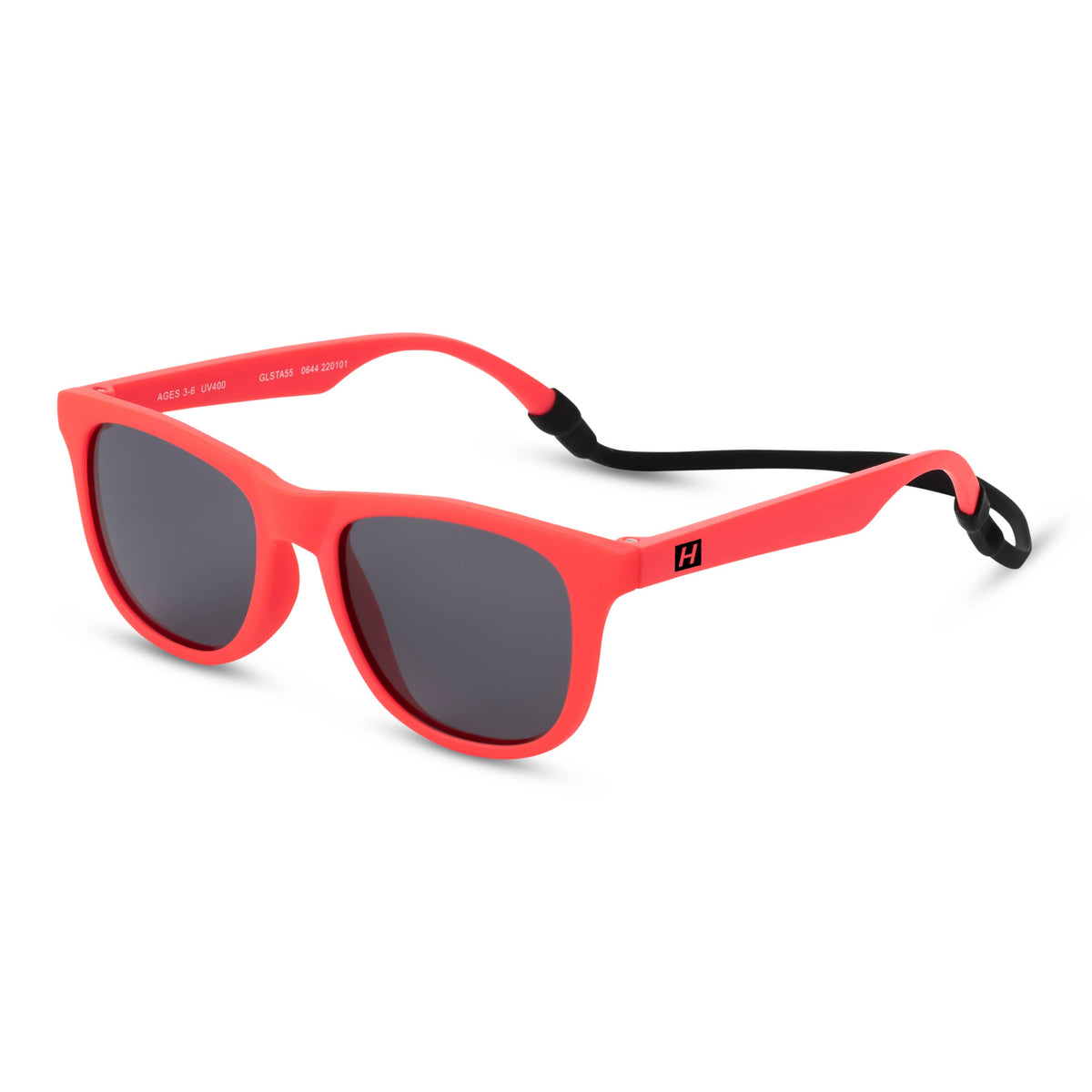 Coral pink sunglasses with dark gray lenses and a black ear-loop strap, shown on a clean white background.