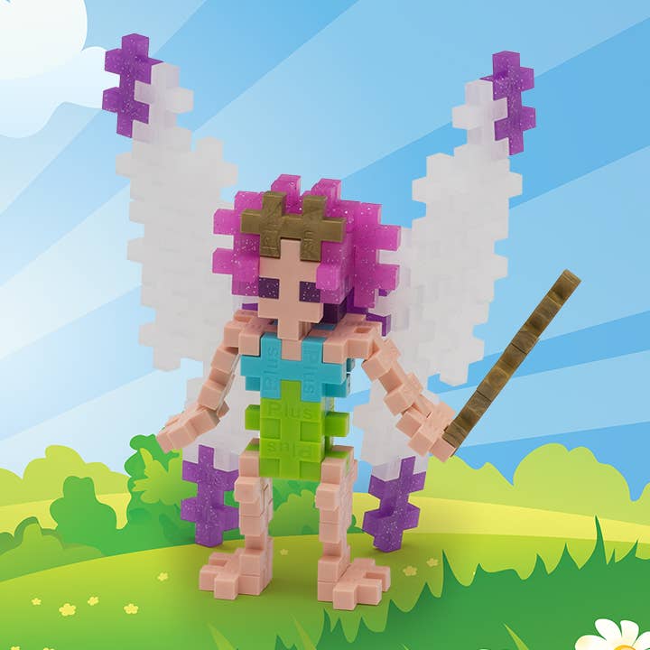 Puzzle fairy figure with fairy wings and a wand on a colorful background