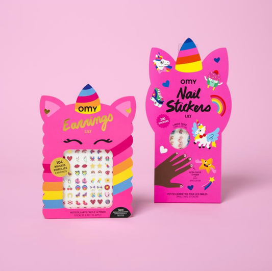Two pink packages of omy nail stickers and earrings on a pink background