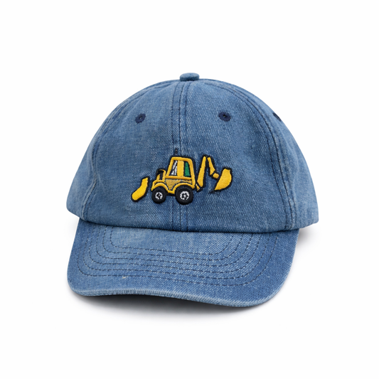 Blue denim cap with a yellow bulldozer emblem on a white background