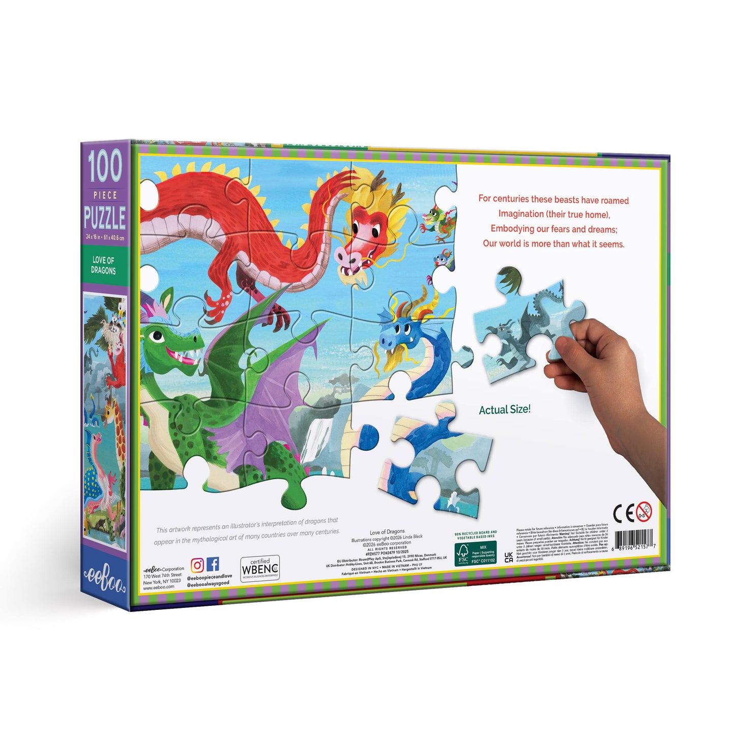 Jigsaw puzzle box with dragons and a hand holding a piece, on a white background