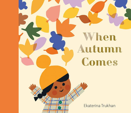 Book cover of 'When Autumn Comes' with a child and autumn leaves.