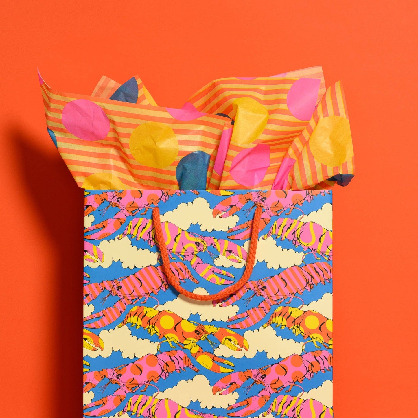 Colorful tote bag with lobster pattern on an orange background