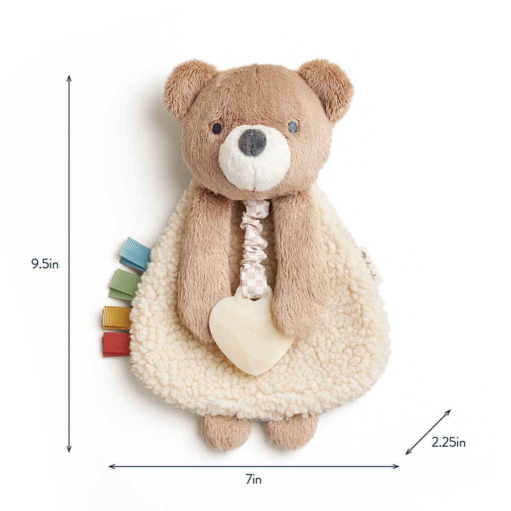 Plush teddy bear toy with measurements on a white background