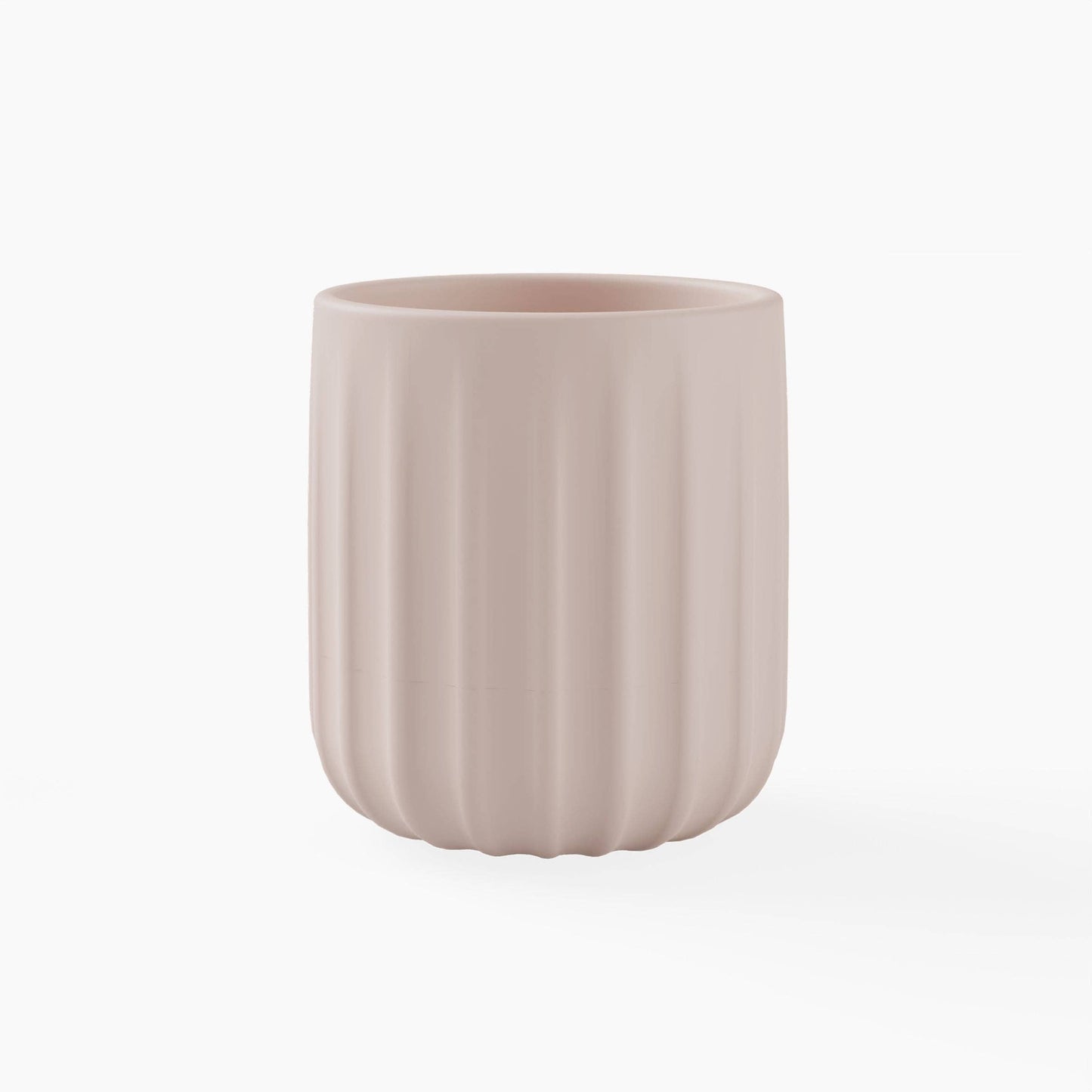 Light pink silicone cup with textured surface on a white background