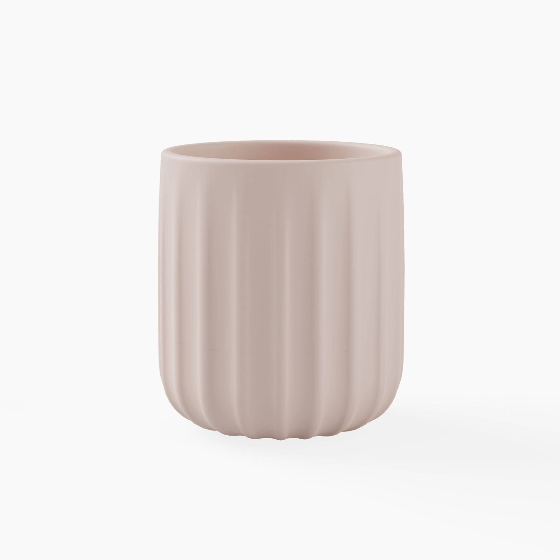 Light pink silicone cup with textured surface on a white background