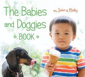 Book cover featuring a child and a dog with text 'The Babies and Doggies Book by John & Molly'.