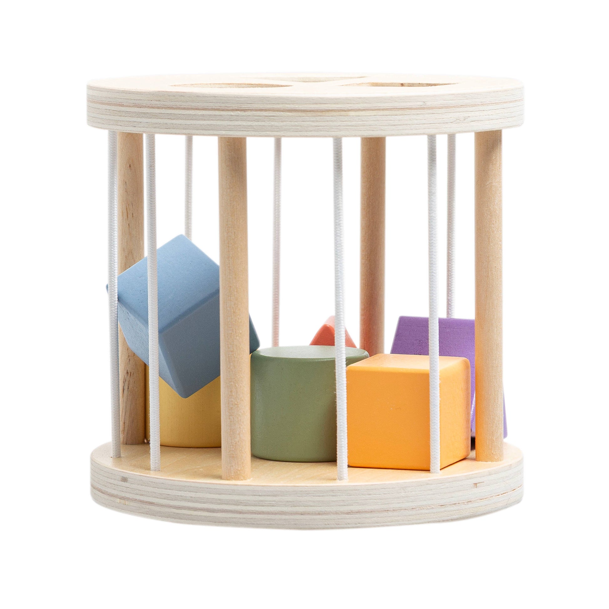 Wooden toy cage with colorful blocks on a white background