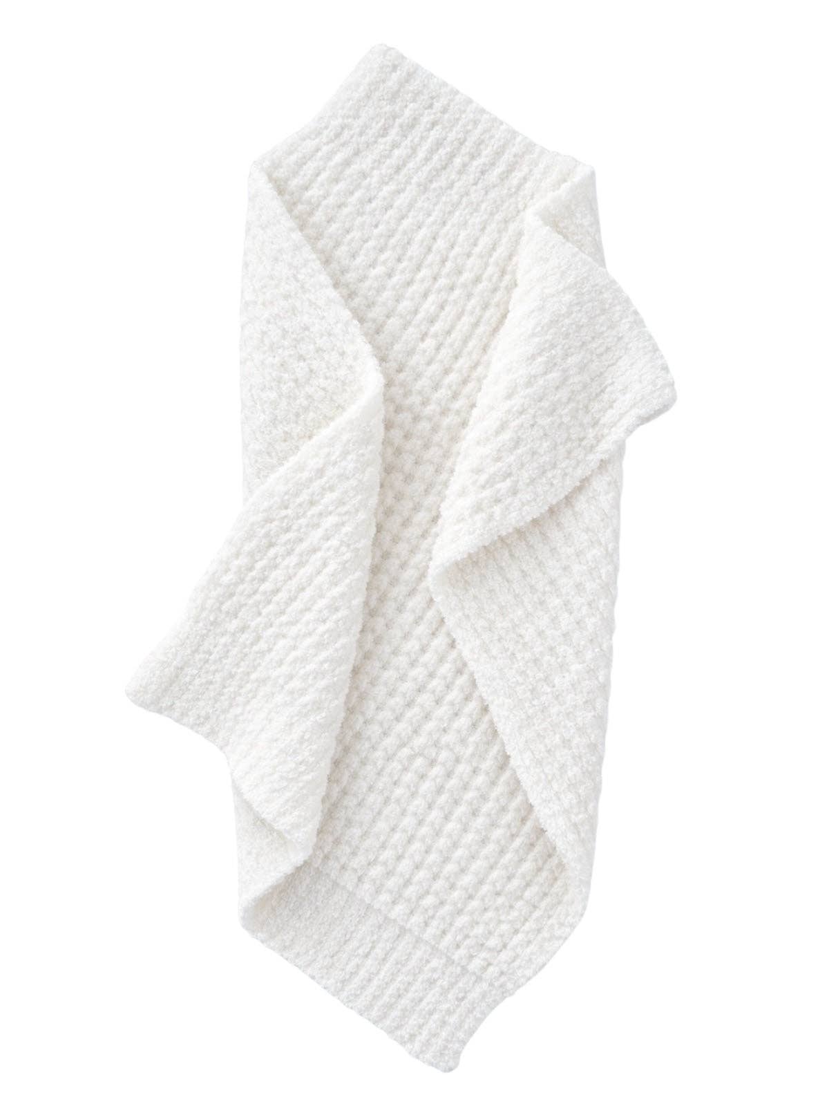 White textured blanket on a white background