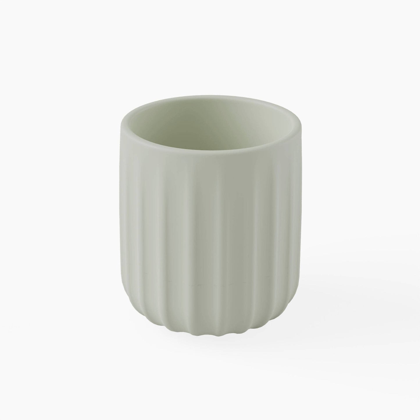 Green silicone cup with ribbed texture on a white background